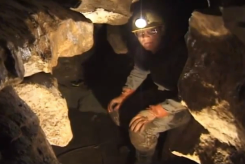 Tim Heaton at work in OYK cave.  Screenshot from video.